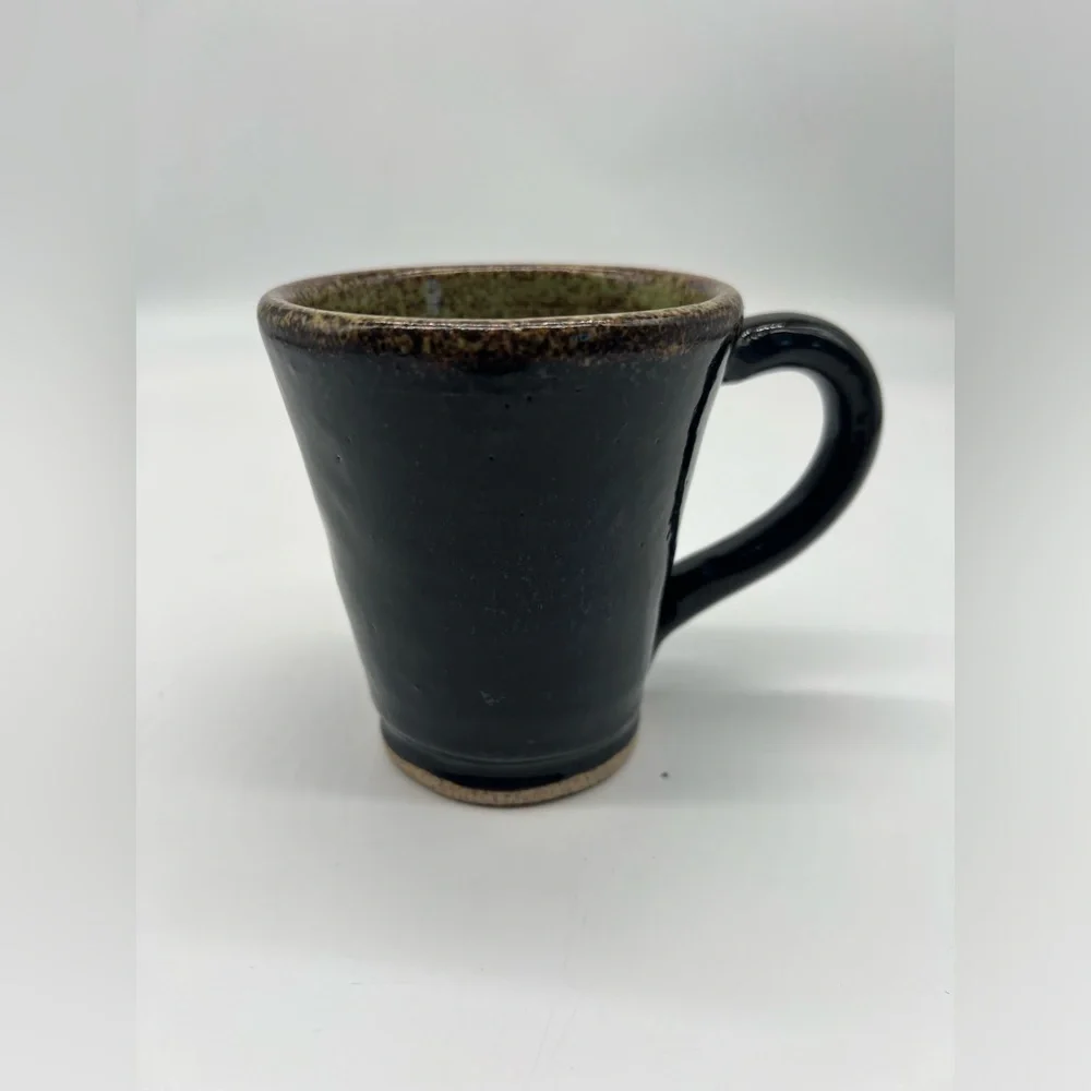 Handmade studio pottery mug with rustic bear design